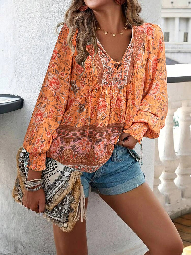 ANGELA| Blusa con estampado floral y puños.