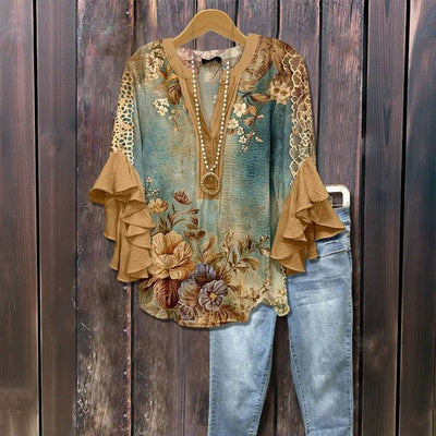 Blusa vintage con estampado floral, mangas con volantes.