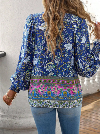 ANGELA| Blusa con estampado floral y puños.