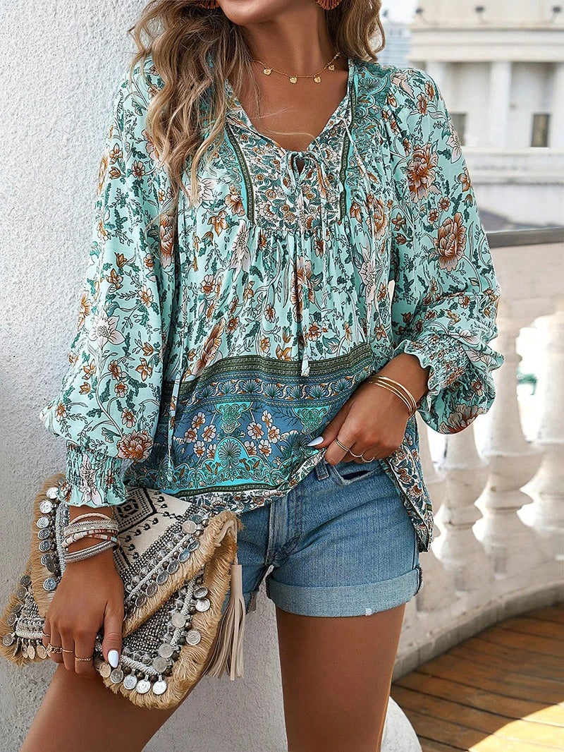 ANGELA| Blusa con estampado floral y puños.