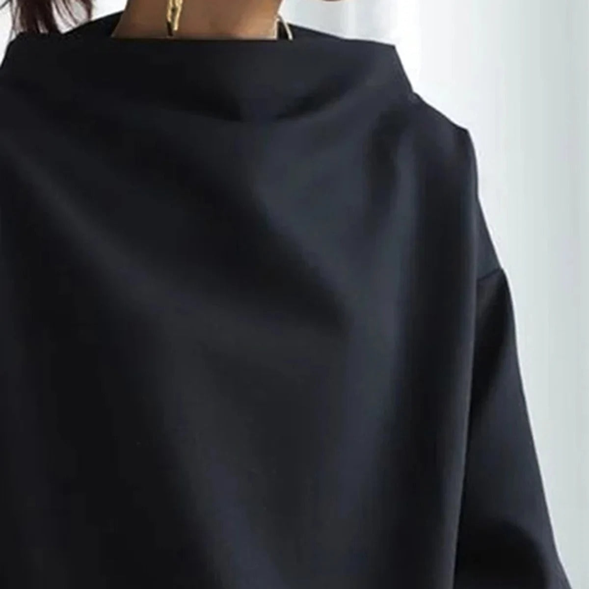 ELENA, elegante jersey de manga larga.