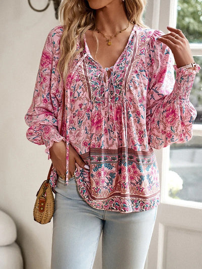 ANGELA| Blusa con estampado floral y puños.