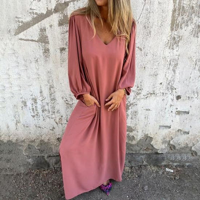 OLGA|Vestido largo fluido con escote en V y mangas abullonadas .