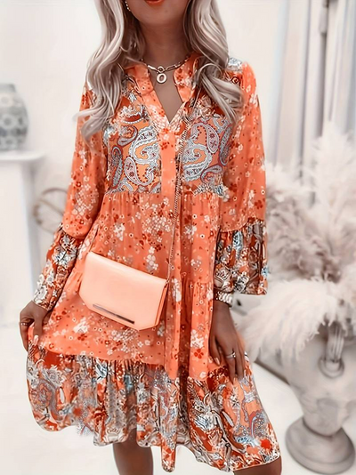 ALBA| Vestido floral, manga larga y un comodo corte holgado.