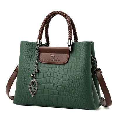 Bolso de cuero auténtico con correa ajustable.