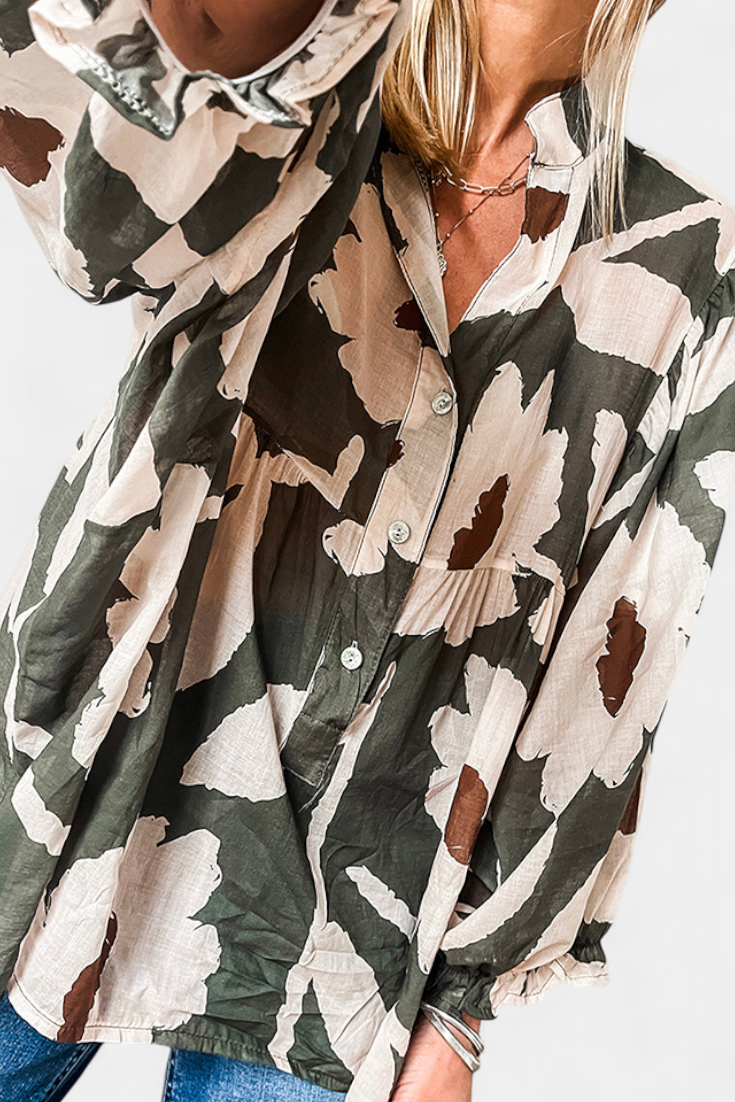 LARA| Blusa con Media Botonadura y Manga Abullonada en Estampado Floral Abstracto