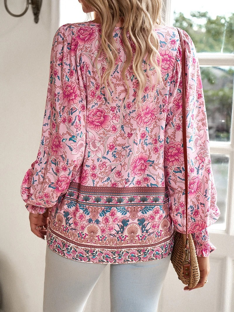 ANGELA| Blusa con estampado floral y puños.