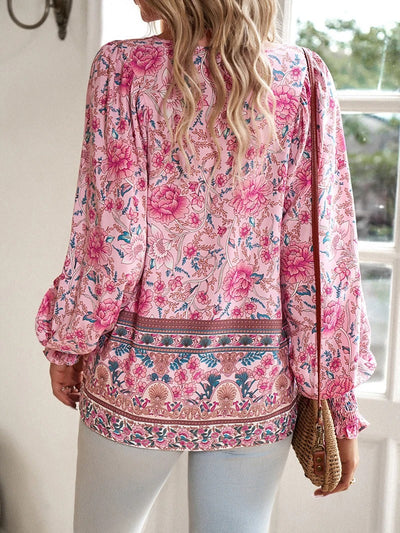 ANGELA| Blusa con estampado floral y puños.