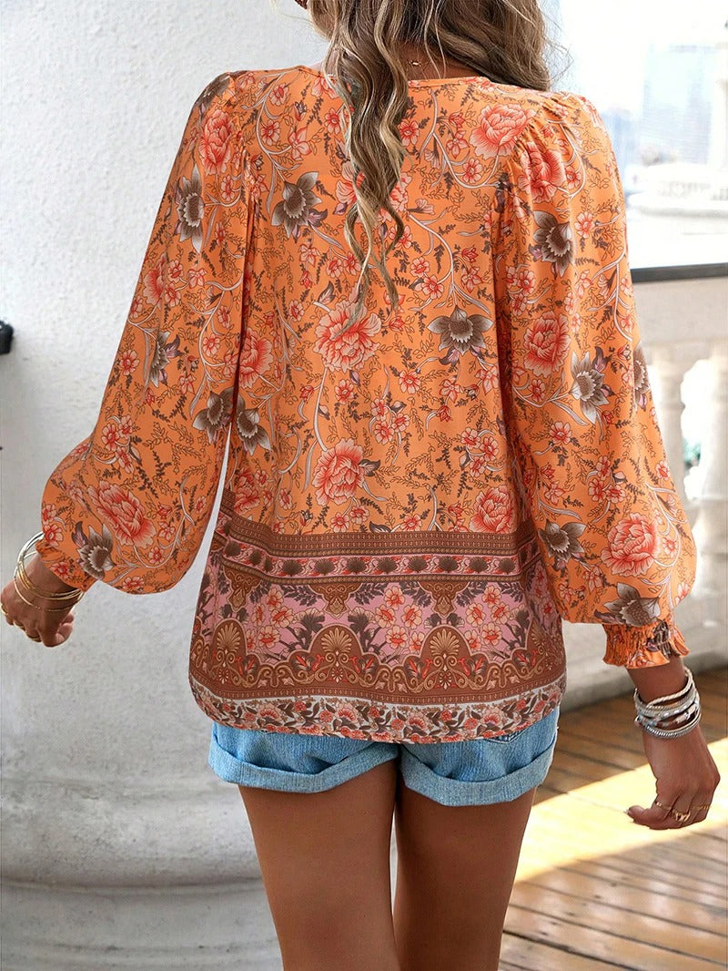 ANGELA| Blusa con estampado floral y puños.