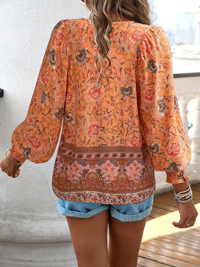 ANGELA| Blusa con estampado floral y puños.