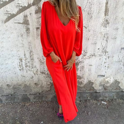 OLGA|Vestido largo fluido con escote en V y mangas abullonadas .