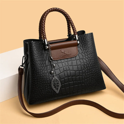 Bolso de cuero auténtico con correa ajustable.
